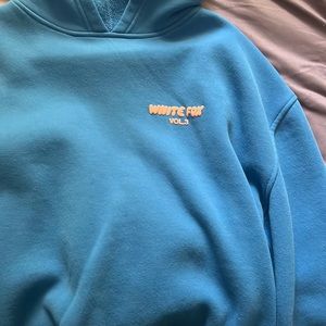 White fox hoodie, royal blue with coral print.